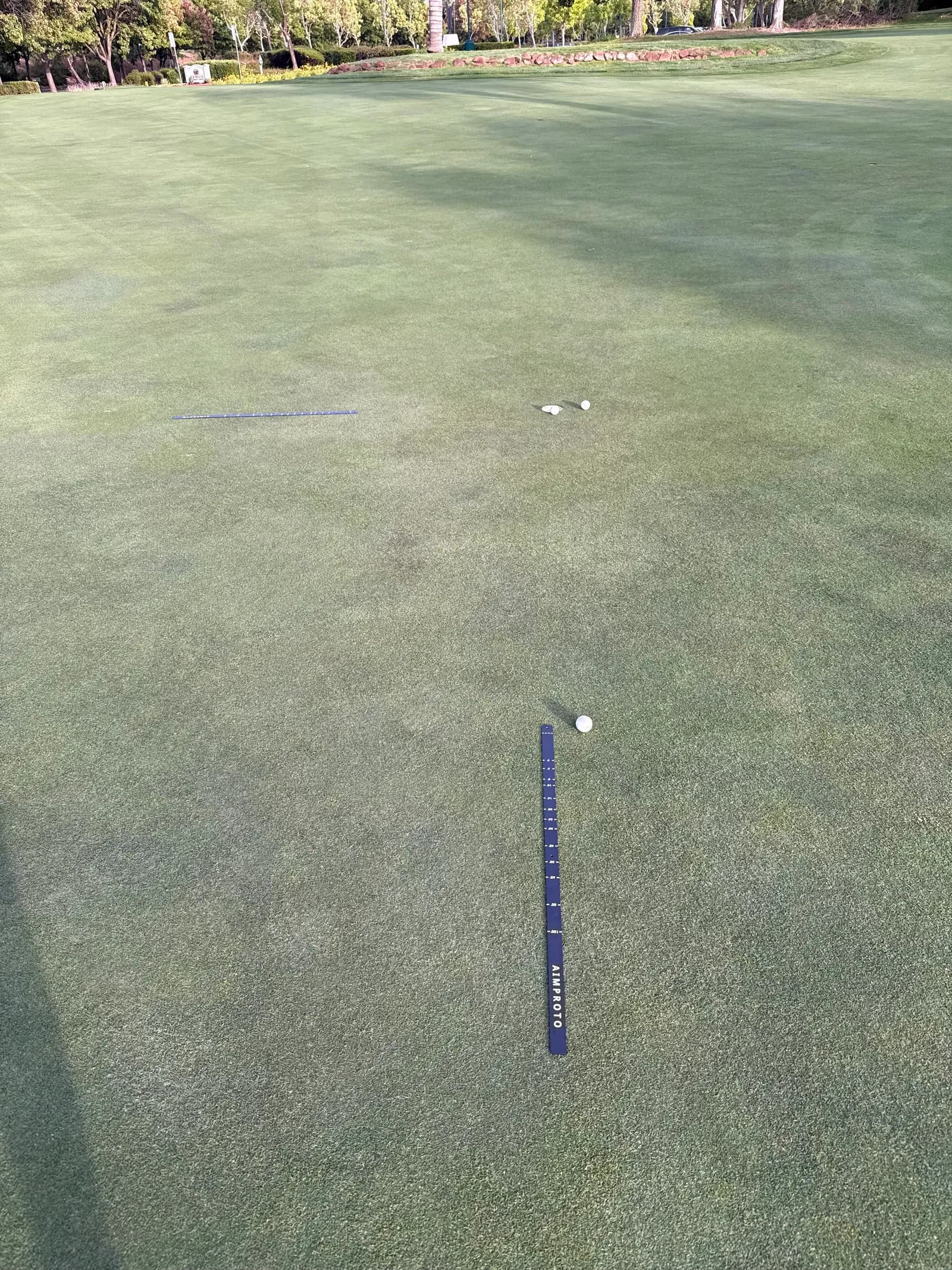 AimPutt set up on a putting green for distance-control practice